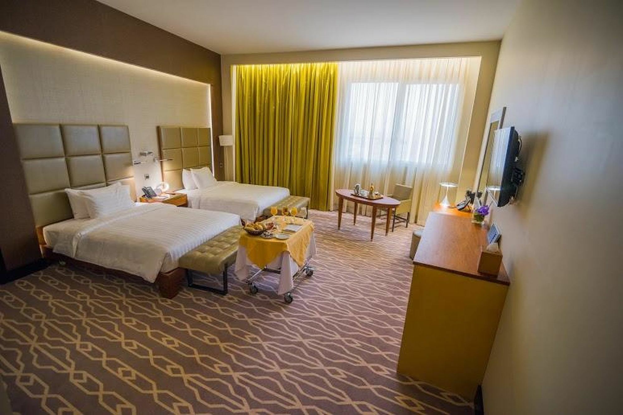 Millennium Hail Hotel Exteriér fotografie A room at the hotel